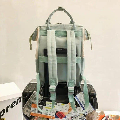 Stevvex pastel mint laptop backpack with padded shoulder straps and top handle on display on Tampa Home & Garden Store