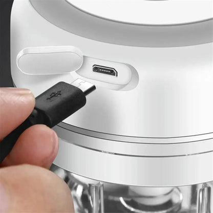 Stevvex white electric garlic press with USB-C charging port being plugged in on Tampa Home & Garden Store