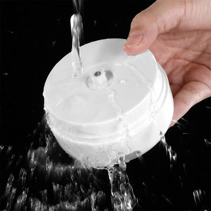 Stevvex mini electric garlic press, white plastic, compact design under running water on Tampa Home & Garden Store