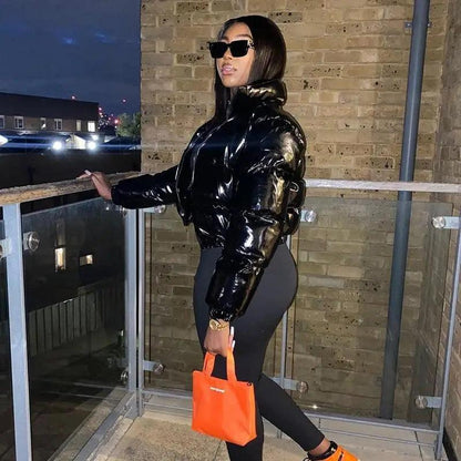 Stevvex faux PU leather bubble puffer jacket, black glossy outerwear with zipper, orange handbag on Tampa Home & Garden Store