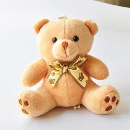Stevvex teddy bear plush toy, beige fluffy bear with paw-print ribbon bow and hanging loop on Tampa Home & Garden Store
