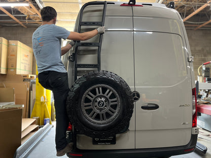 Avatar Offroad Van Rear Ladder Tire Carrier mount on a gray Mercedes van with spare tire on Tampa Home & Garden Store