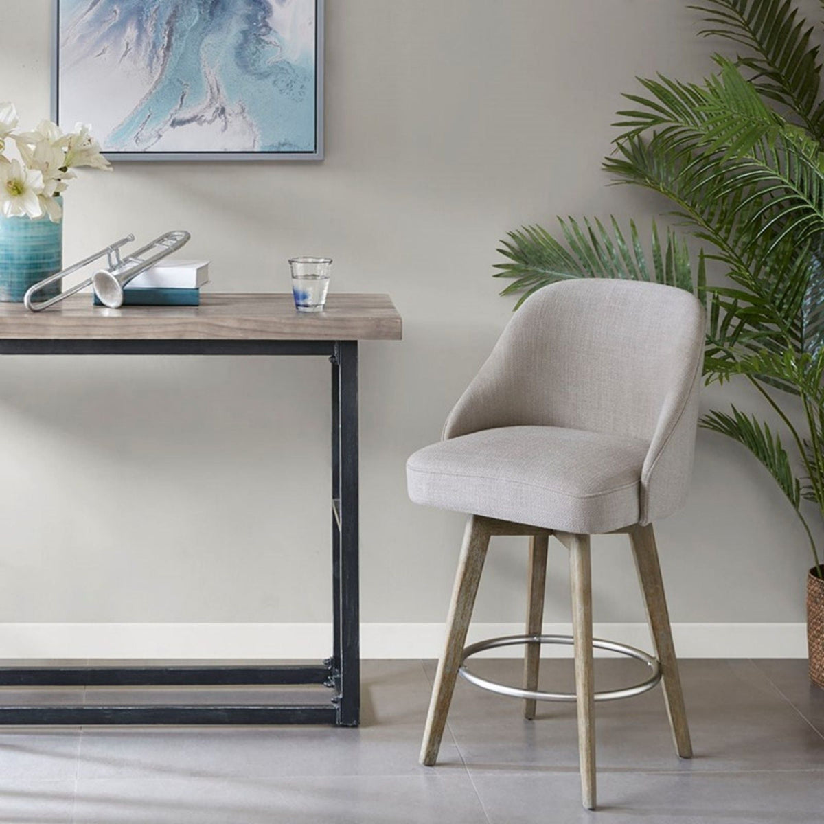 Counter stool with swivel beige upholstered seat on solid wood legs with metal footrest on Tampa Home & Garden Store