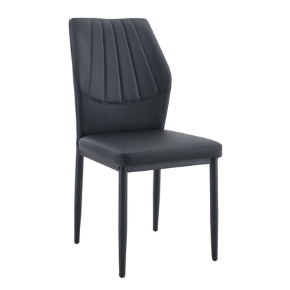 Dining chair with shell pattern back in black faux leather by HouseOfZazla on Tampa Home & Garden Store