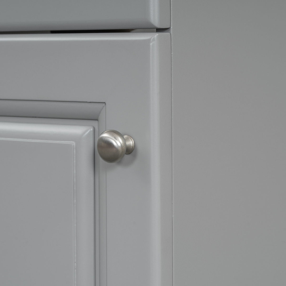 Gray bathroom vanity cabinet door with a round metal knob on Tampa Home & Garden Store