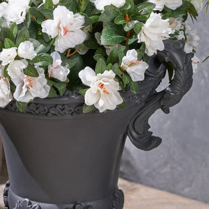 Delphine Urn Planter by HouseOfZazla with white blooms in an ornate black planter on Tampa Home & Garden Store