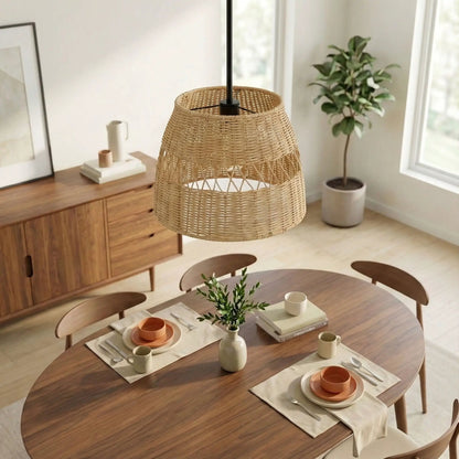 Essence pendant light with shade, black metal top and natural rattan, over a wooden dining table on Tampa Home & Garden Store