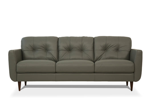 Radwan Pesto Sofa in pesto green faux leather with tufted back and tapered wood legs on Tampa Home & Garden Store