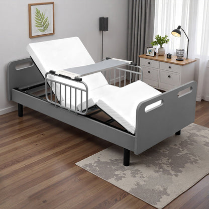 Electric adjustable hospital bed with gray metal frame and white mattress in a home bedroom on Tampa Home & Garden Store