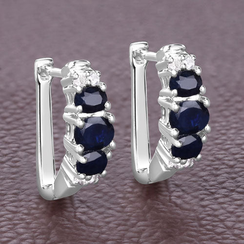 Sterling silver earrings with 1.66ct blue sapphire and white topaz stones, prong-set on Tampa Home & Garden Store