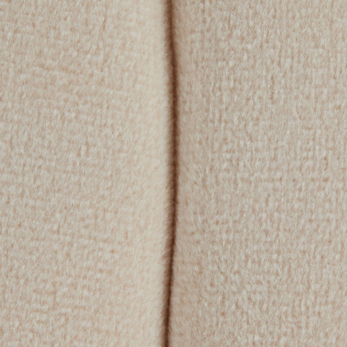 Accent ottoman beige textured upholstery close-up with seam on Tampa Home & Garden Store