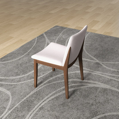 Mid-Century Modern solid wood dining chairs with white fabric upholstery, two on a gray rug on Tampa Home & Garden Store