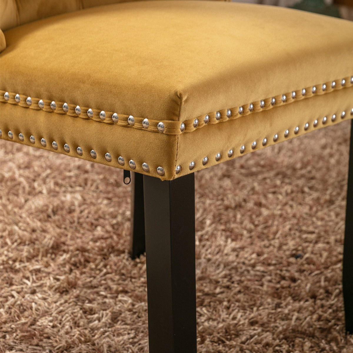 Mustard velvet tufted dining chair with nailhead trim and black legs, part of a chair set on Tampa Home & Garden Store
