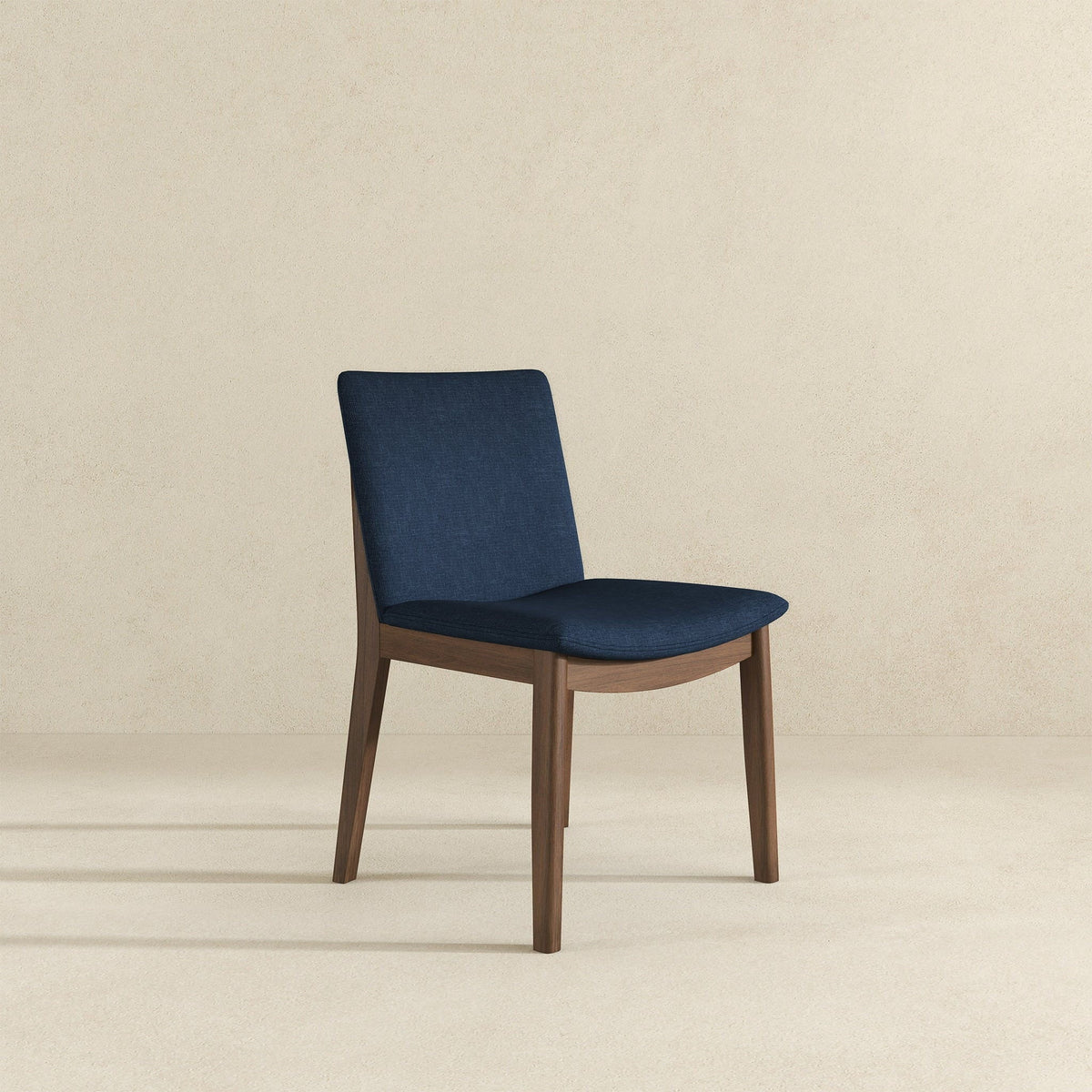 Mid-Century Modern solid wood dining chair with navy blue fabric upholstery on Tampa Home & Garden Store