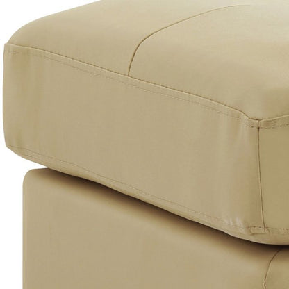 Upholstered beige ottoman in faux leather on Tampa Home & Garden Store