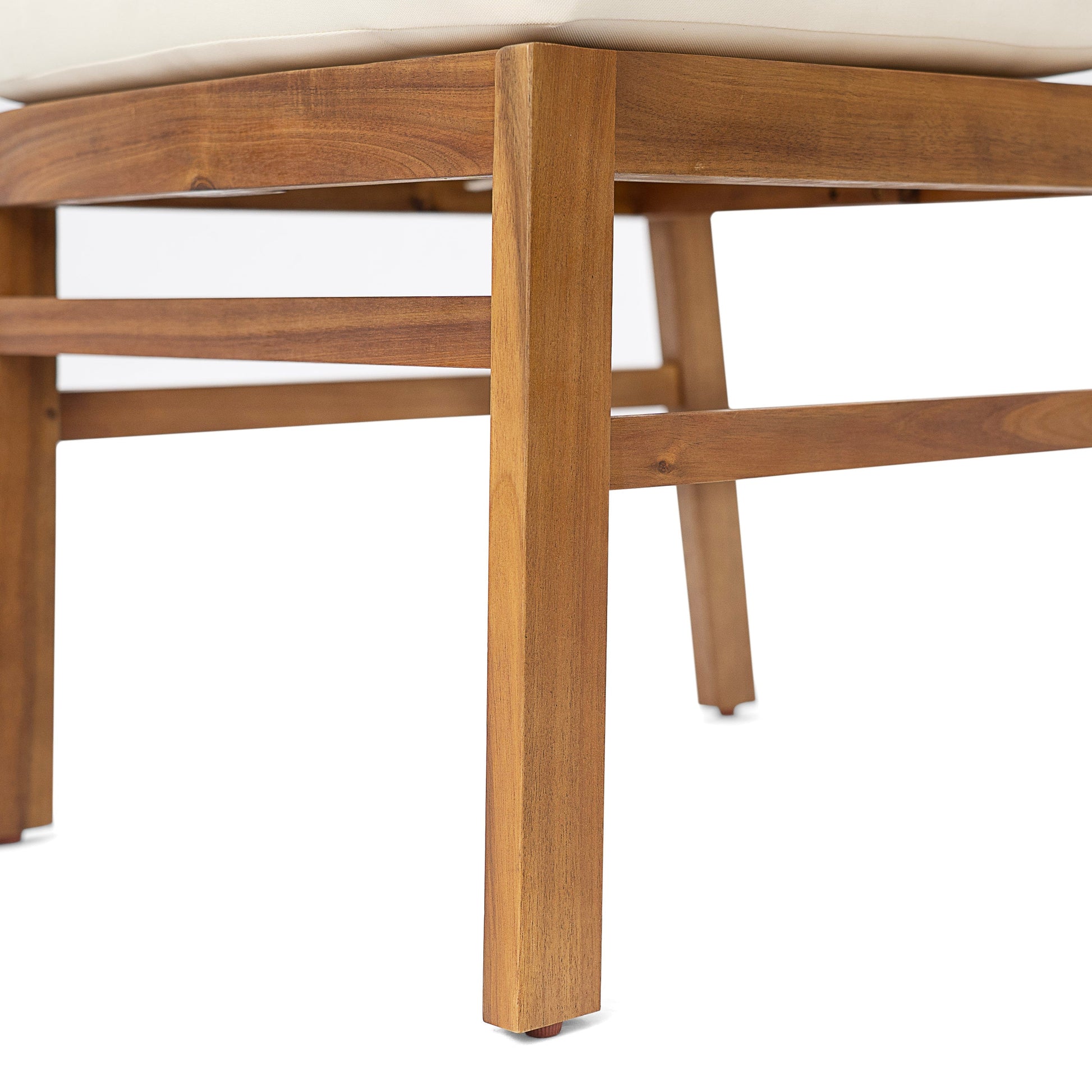 Outdoor acacia wood dining set leg detail with teak finish and beige cushion on Tampa Home & Garden Store
