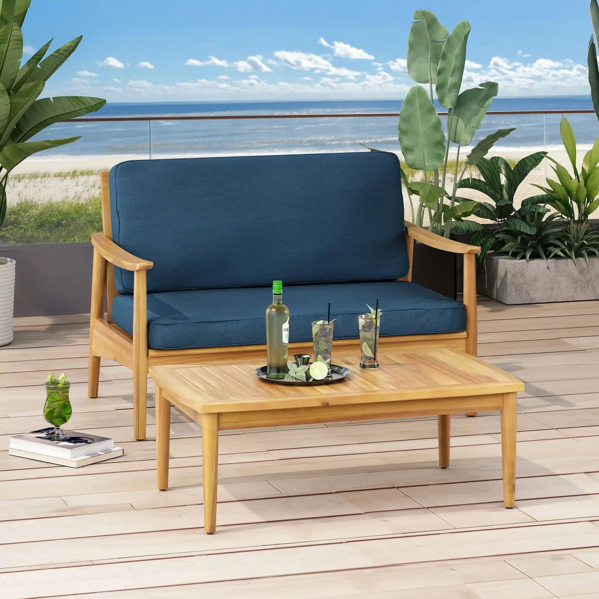 Outdoor acacia wood loveseat and coffee table set with blue cushions for 2 on a beach deck on Tampa Home & Garden Store