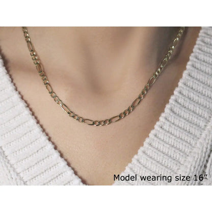 3.8mm 14k yellow gold solid Figaro chain necklace by Bids.com worn on model neck on Tampa Home & Garden Store
