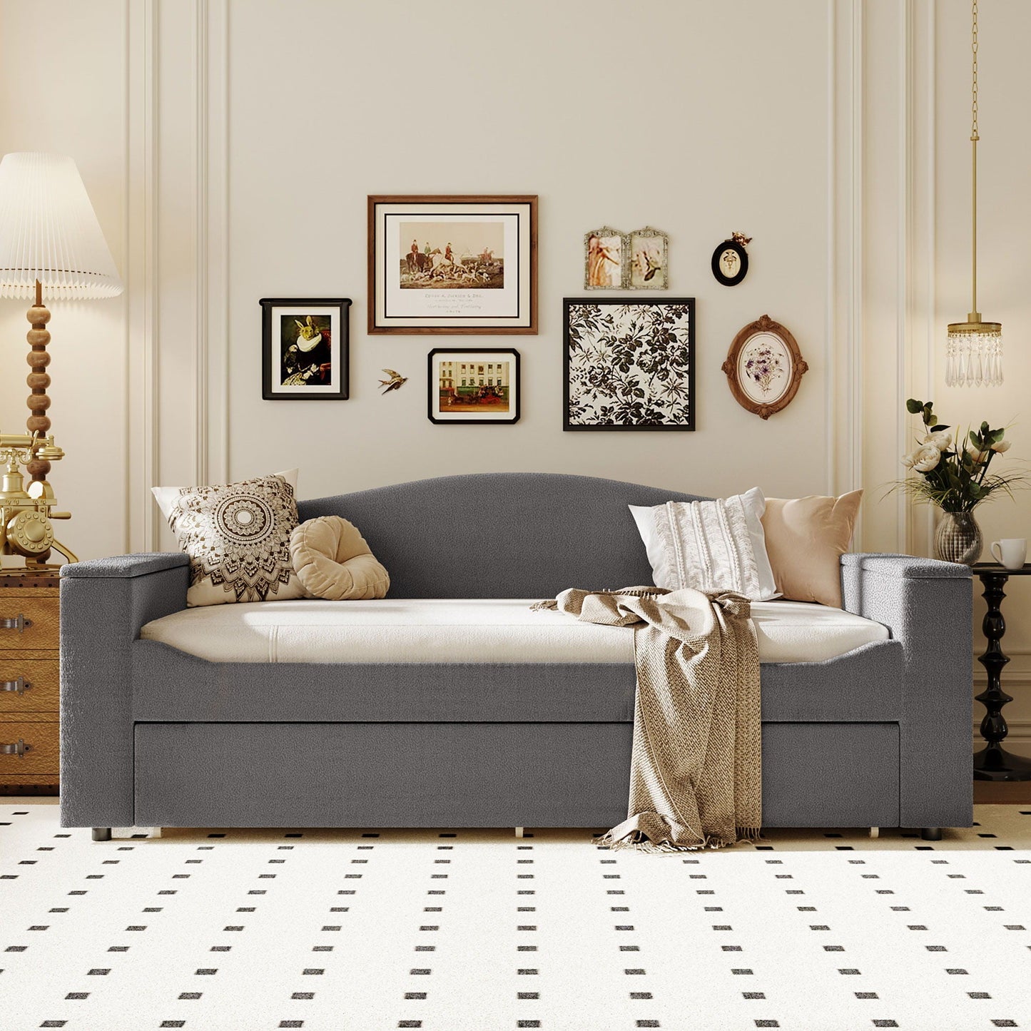 Upholstered grey daybed with storage drawer and beige pillows in a stylish living room on Tampa Home & Garden Store