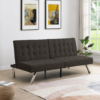Futon sofa bed in dark charcoal with tufted cushions and metal legs; two wall artworks on Tampa Home & Garden Store