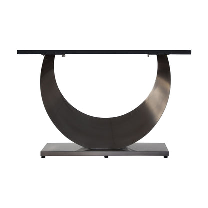 Modern artificial stone dining table with crescent-shaped metal legs and dark top on Tampa Home & Garden Store