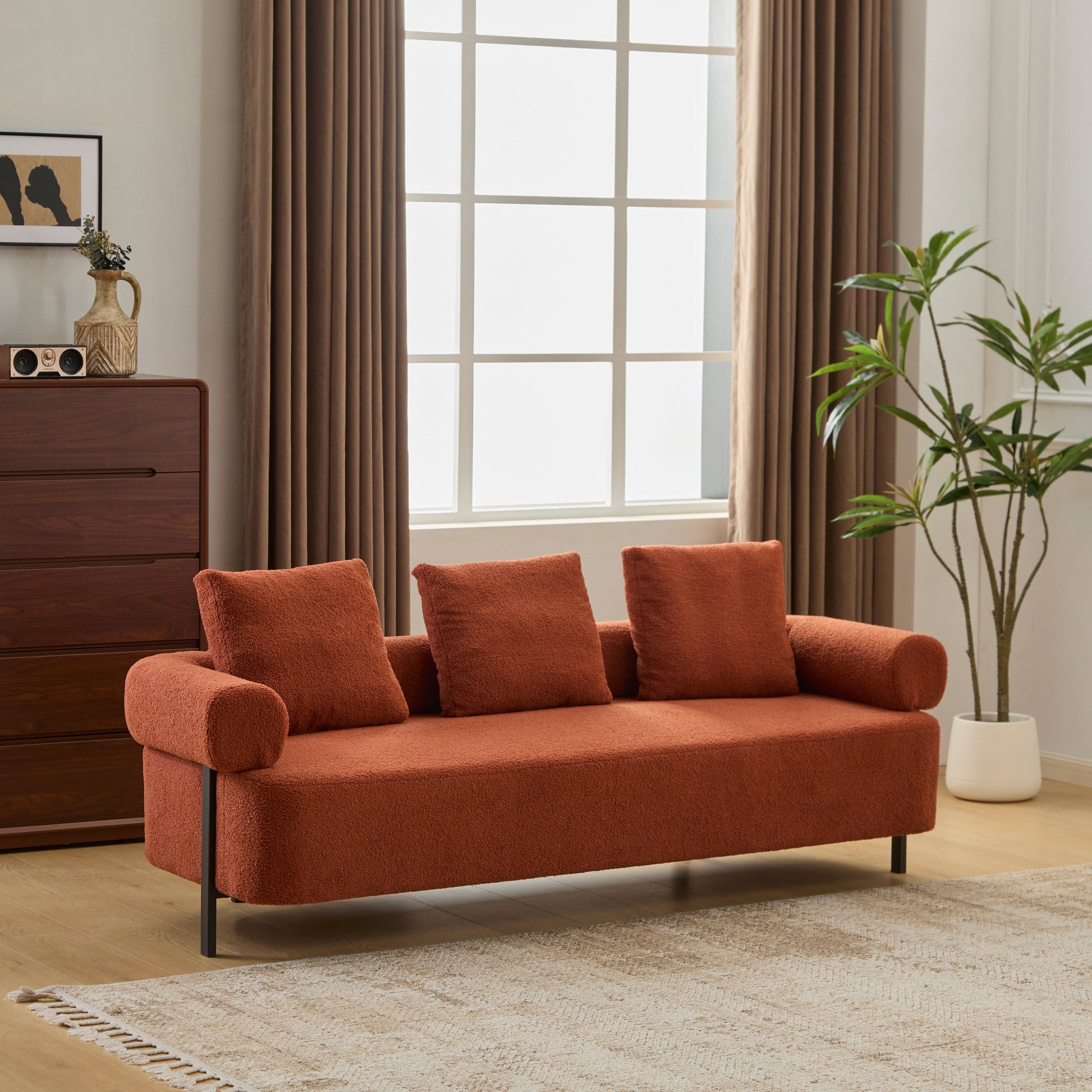 78-inch 3-Seater Sofa by HouseOfZazla burnt orange bouclé with black legs in a living room on Tampa Home & Garden Store