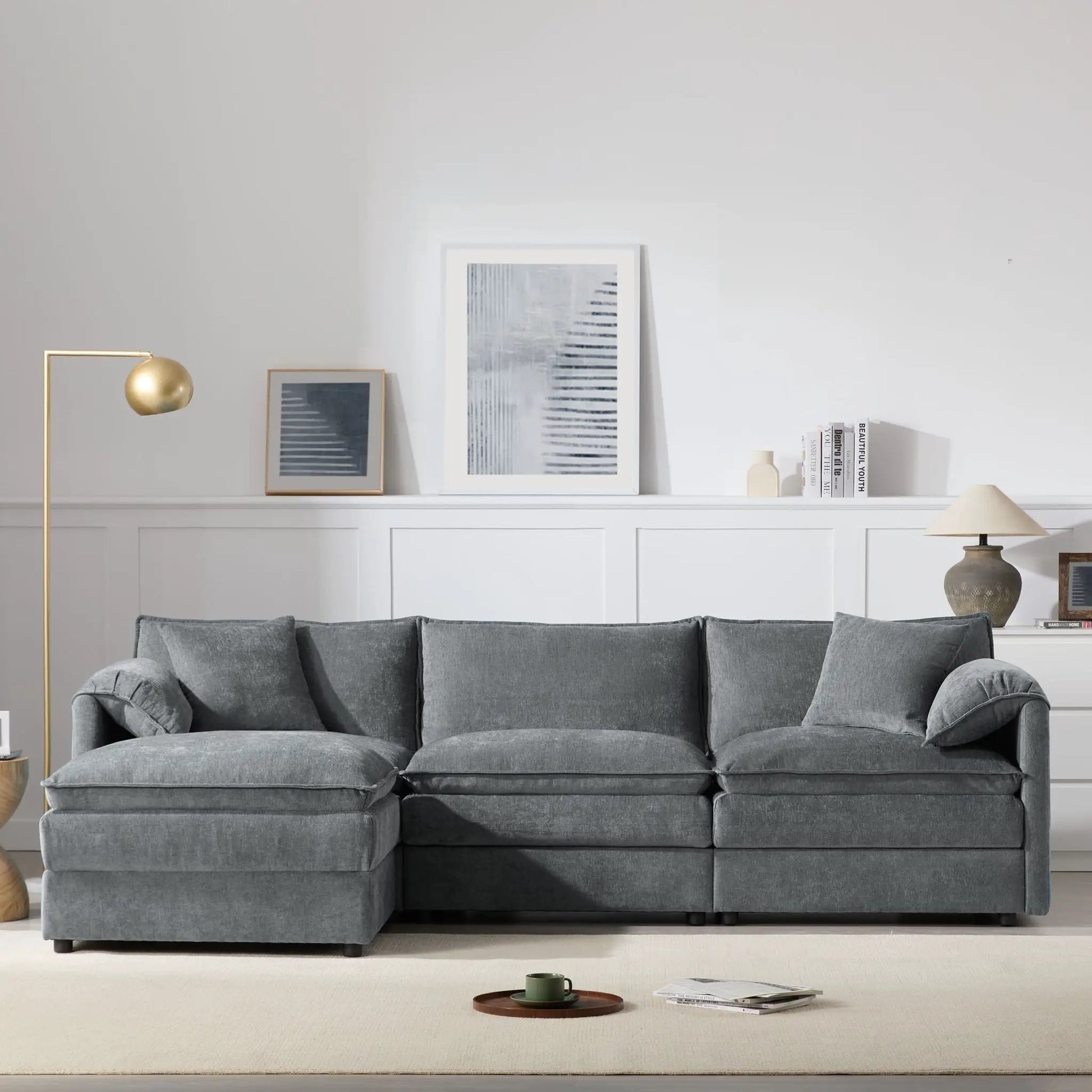 Gray modular sectional sofa with seats and movable ottoman on Tampa Home & Garden Store
