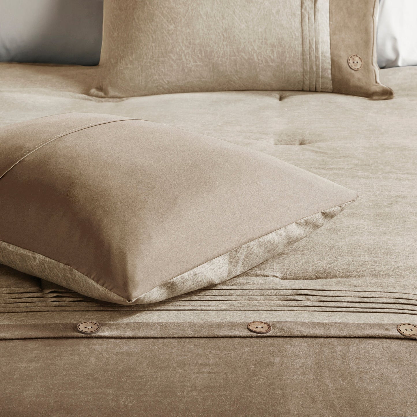 7 Piece Tan Faux Suede King Comforter Set on bed with textured fabric and pleated pillow on Tampa Home & Garden Store