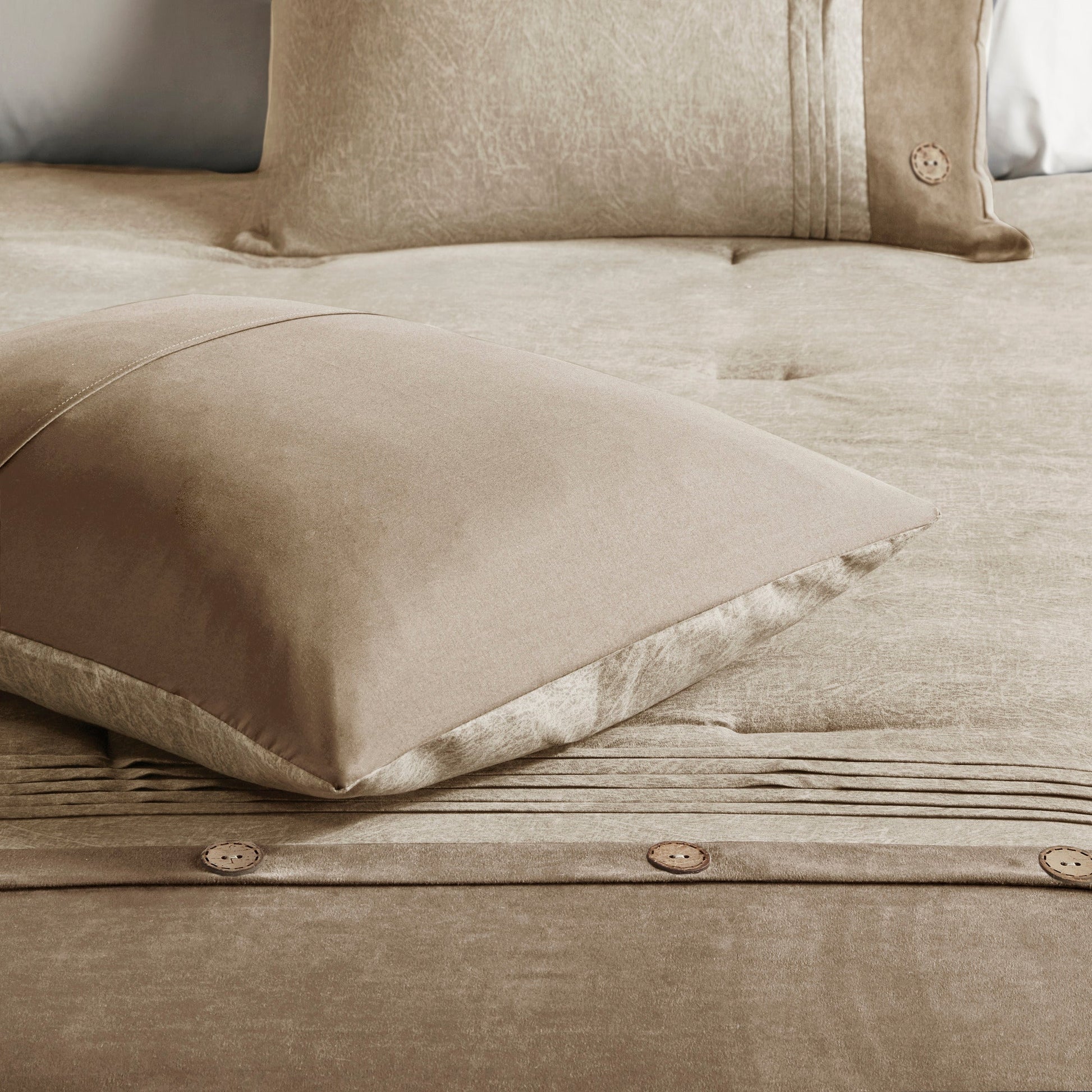 7 Piece Tan Faux Suede King Comforter Set on bed with textured fabric and pleated pillow on Tampa Home & Garden Store