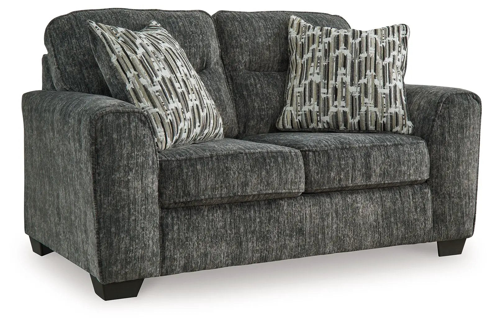 Lonoke stationary loveseat in dark gray fabric with geometric pillows on Tampa Home & Garden Store