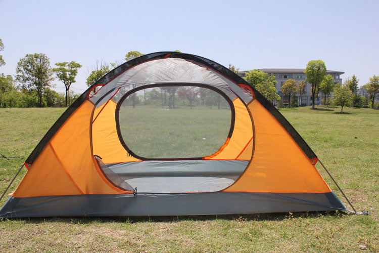 Orange double camping tent on grassy field, rainproof outdoor camping equipment on Tampa Home & Garden Store