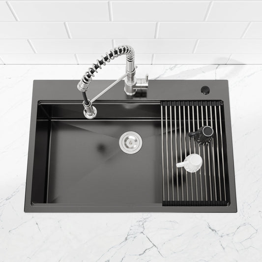 Stainless steel pull-down kitchen faucet with coiled hose over black sink with drain rack on Tampa Home & Garden Store