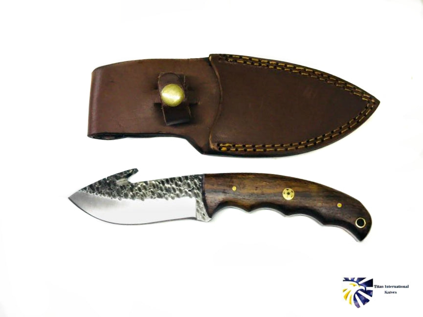 Hand forged carbon gut hook skinner knife by Titan TC-017 with brown wood handle leather sheath on Tampa Home & Garden Store