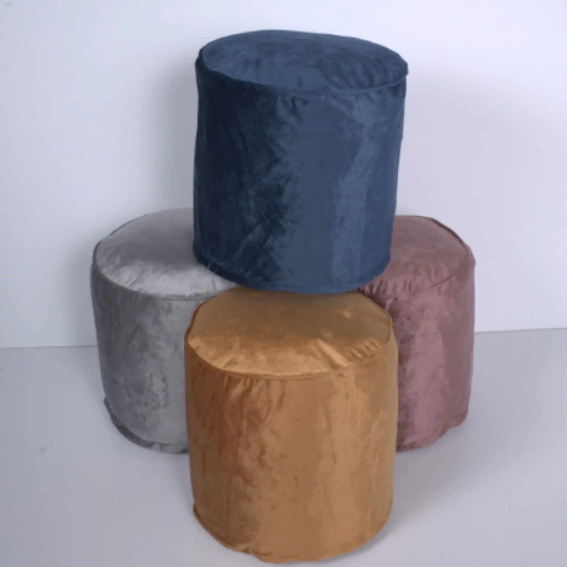 Shimon cylinder velvet pouf ottoman and floor cushion set of 5 in blue gray orange pink on Tampa Home & Garden Store