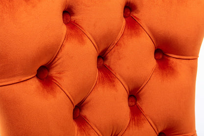 Tufted dining chair set in orange velvet close-up with button-tufted upholstery on Tampa Home & Garden Store