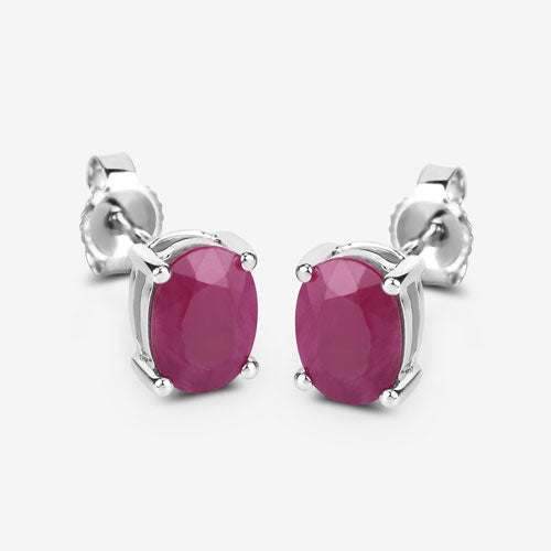 Pair of oval ruby stud earrings in 10K white gold with four-prong settings on Tampa Home & Garden Store