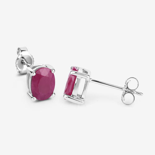 Earrings: 1.70ct genuine ruby studs in 10K white gold, oval pink gems, Bids.com on Tampa Home & Garden Store