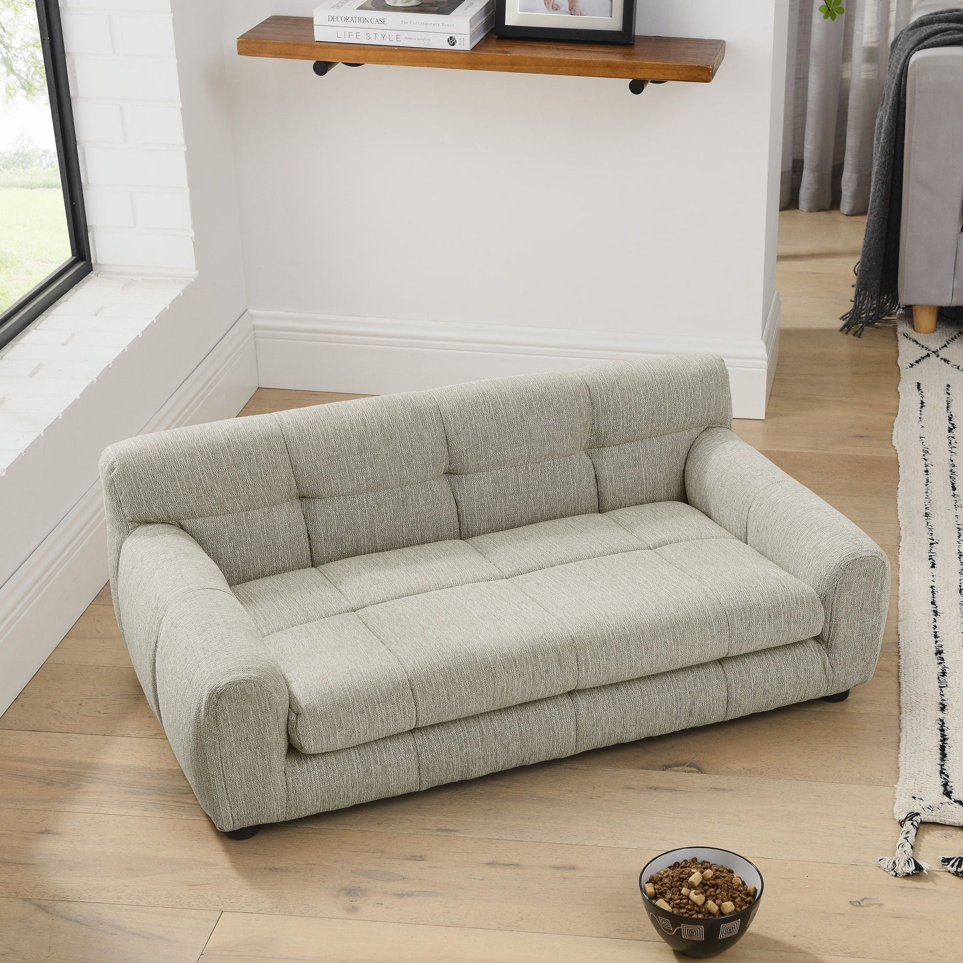 Modern Pet Sofa with Backrest and Armrests in light gray fabric beside dog bowls on wood floor on Tampa Home & Garden Store