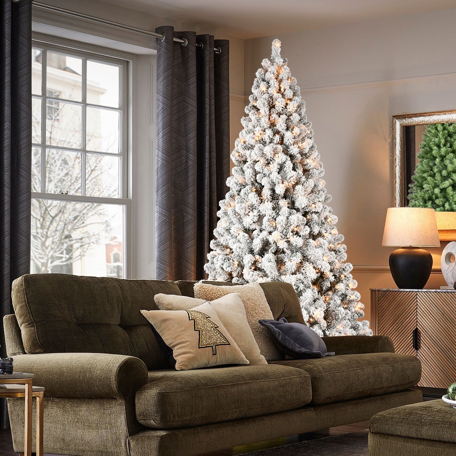 9-Foot Pre-Lit Snow-Flocked Christmas Tree HouseOfZazla in a cozy living room on Tampa Home & Garden Store