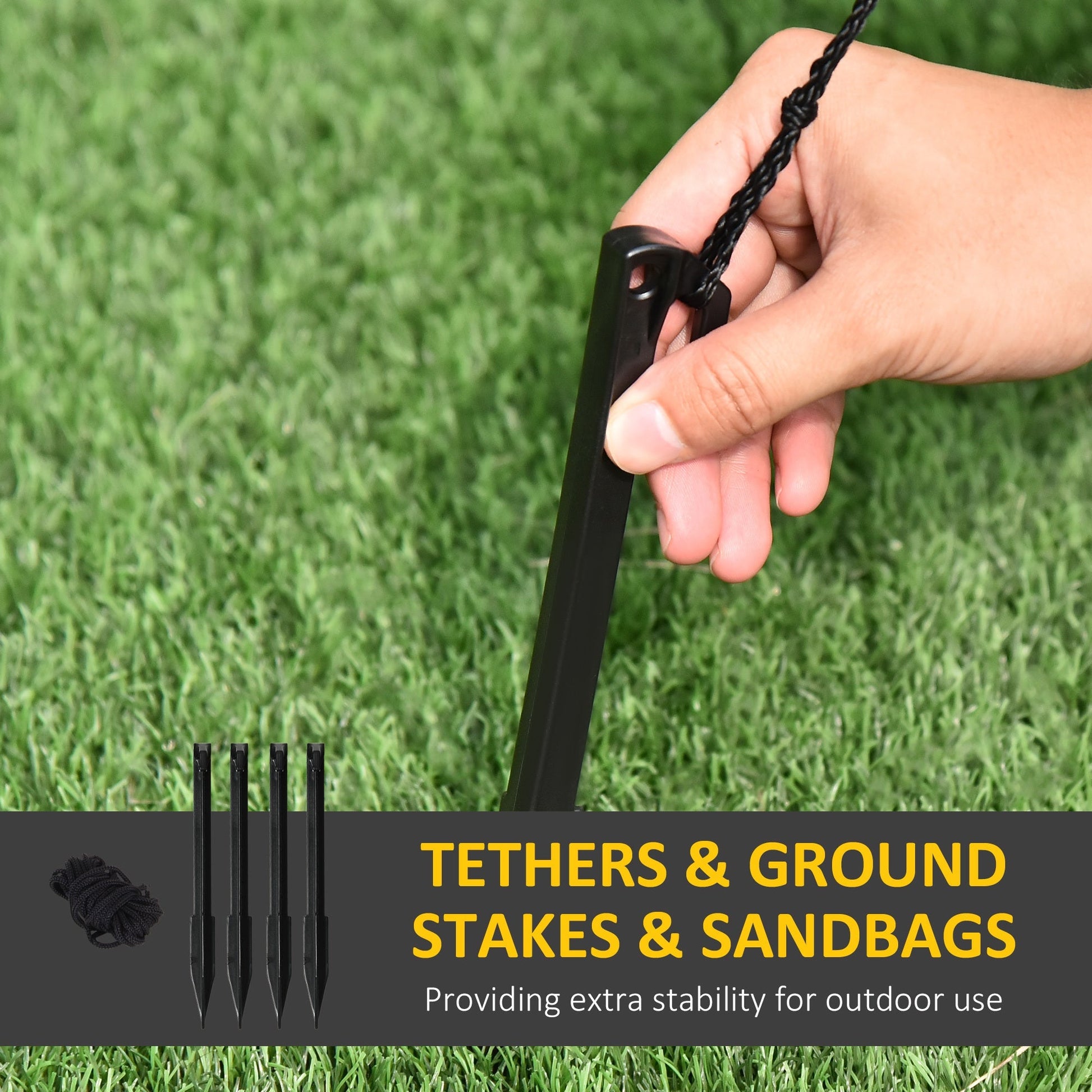 Ground stakes and tethers for outdoor inflatables; black stakes with braided cord held in hand on Tampa Home & Garden Store