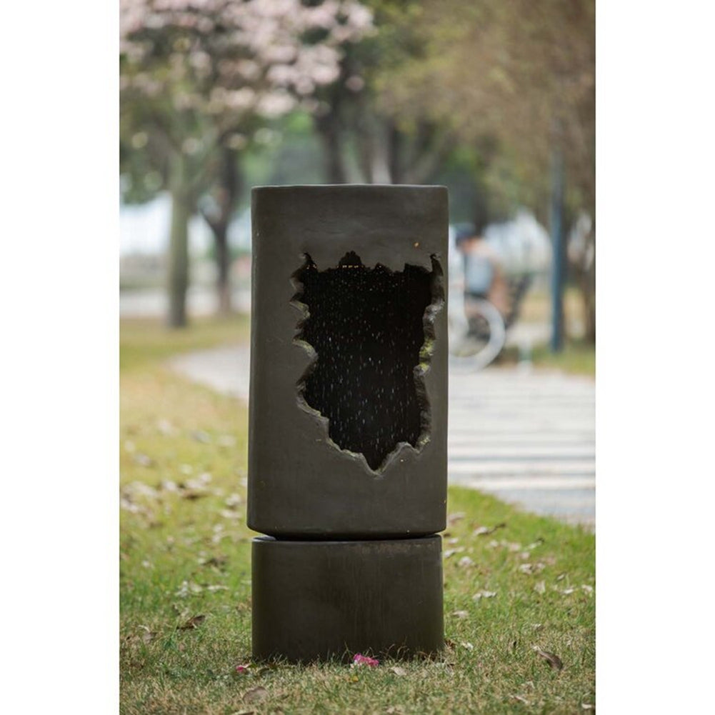 Large Outdoor Water Fountain with Light; dark gray concrete pillar with jagged cutout on Tampa Home & Garden Store