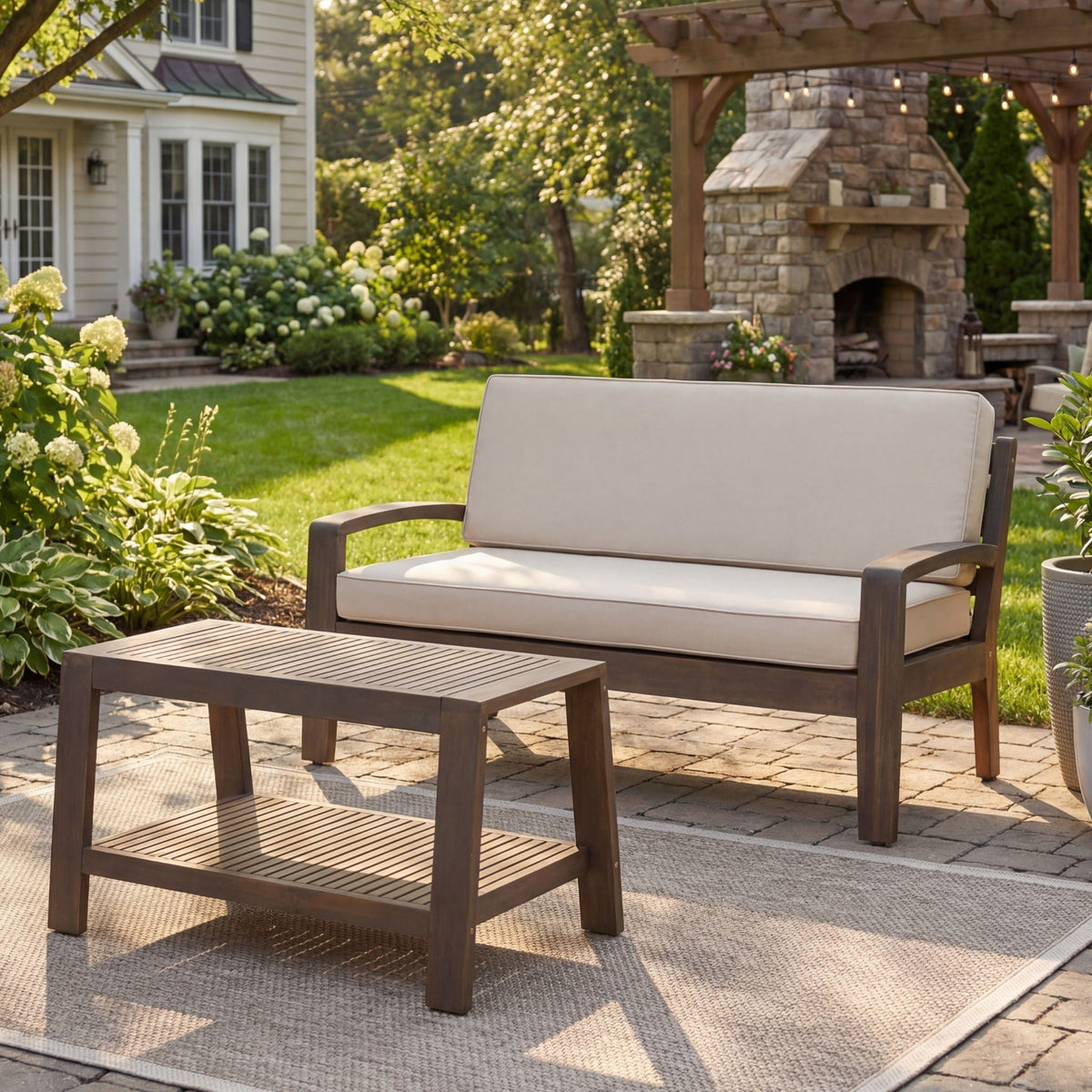 2-piece outdoor loveseat & coffee table set by HouseOfZazla with beige cushions and brown frame on Tampa Home & Garden Store