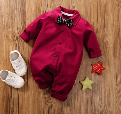 Stevvex baby boy romper with bow in burgundy red, front buttons, long sleeves on floor on Tampa Home & Garden Store