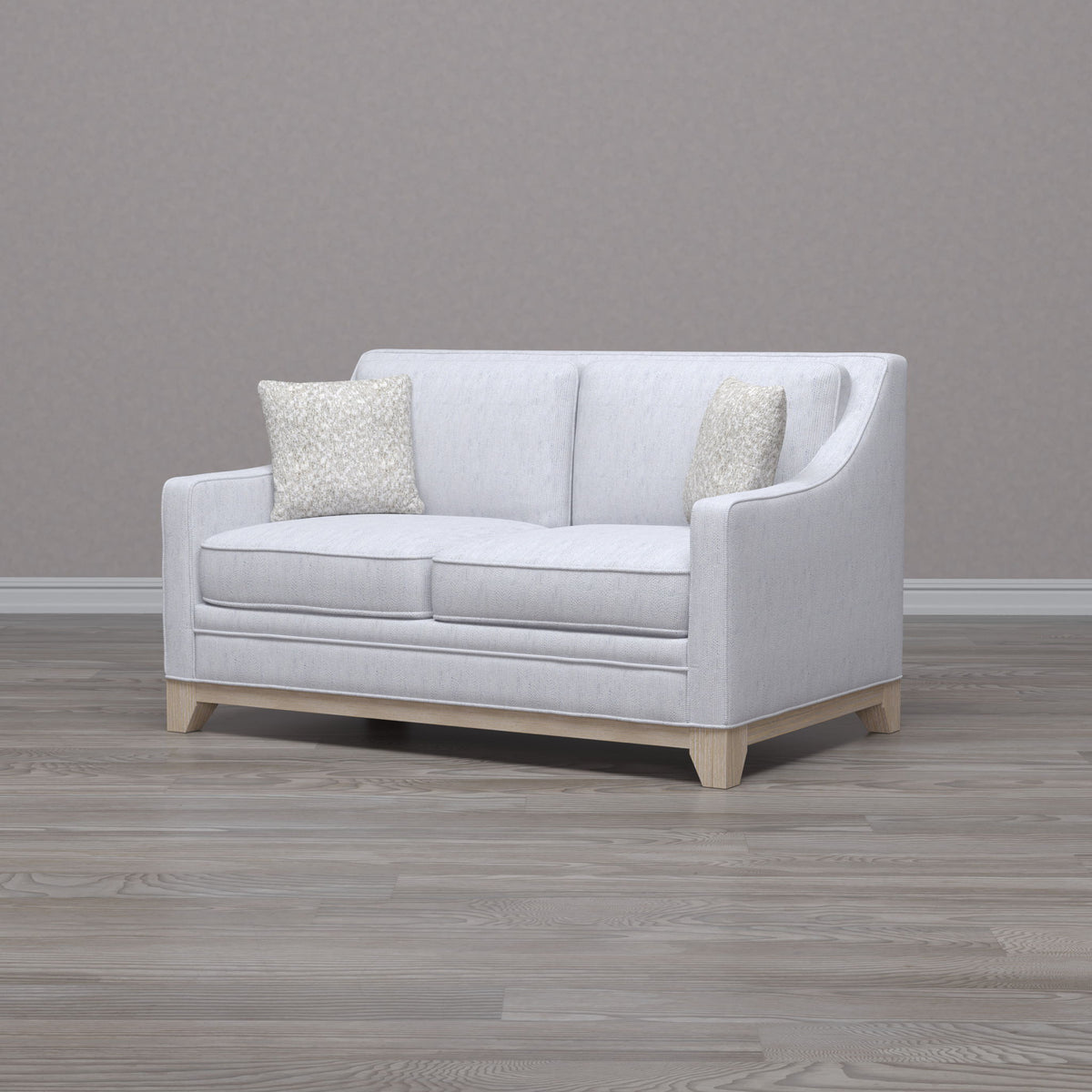 Gray stationary loveseat with durable fabric and 2 beige textured pillows on Tampa Home & Garden Store
