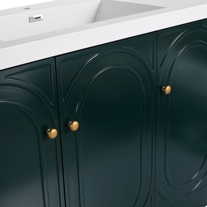 Freestanding bathroom vanity with white top and dark green arched-panel cabinets, brass knobs on Tampa Home & Garden Store