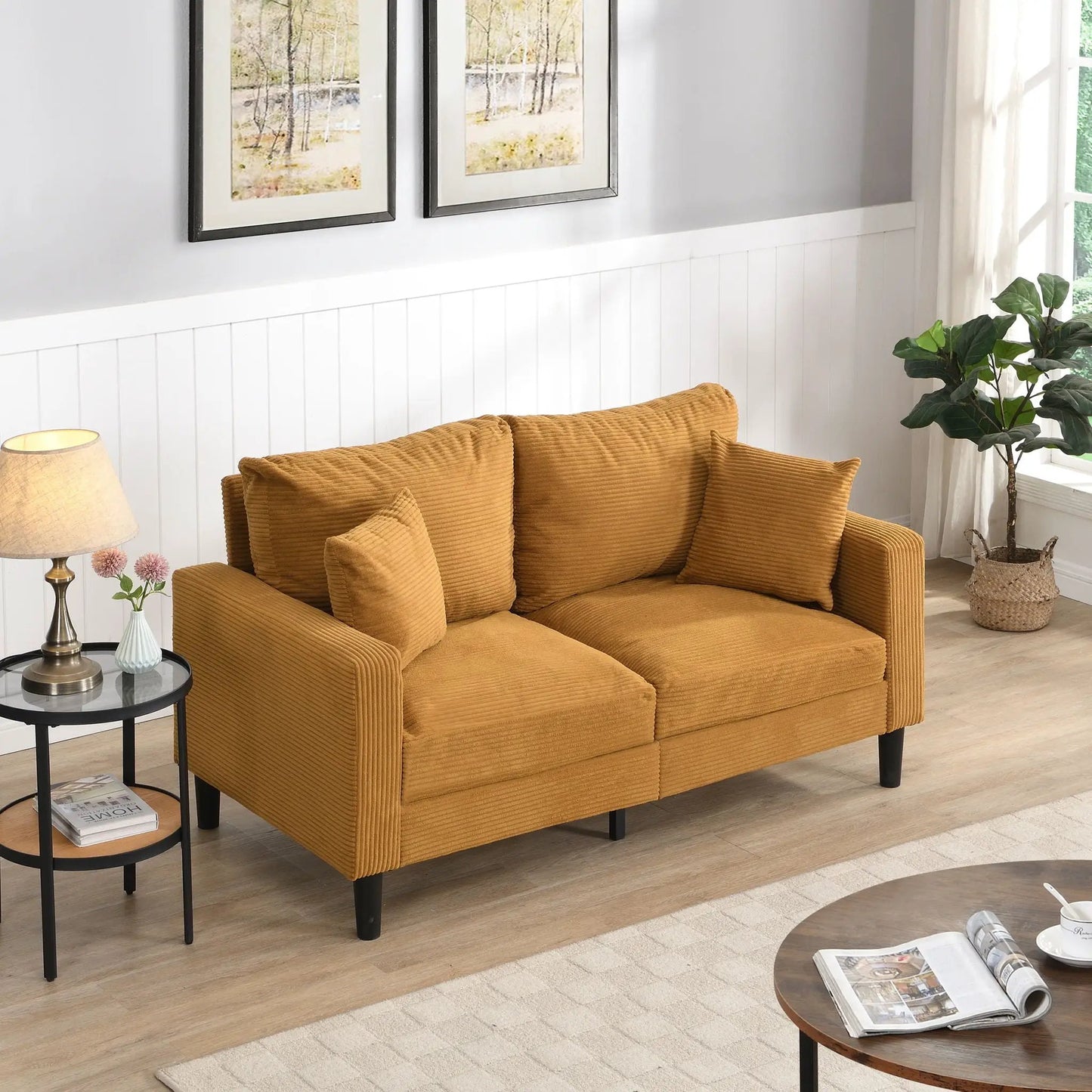 Modern upholstered stationary loveseat in warm caramel corduroy with two cushions and black legs on Tampa Home & Garden Store