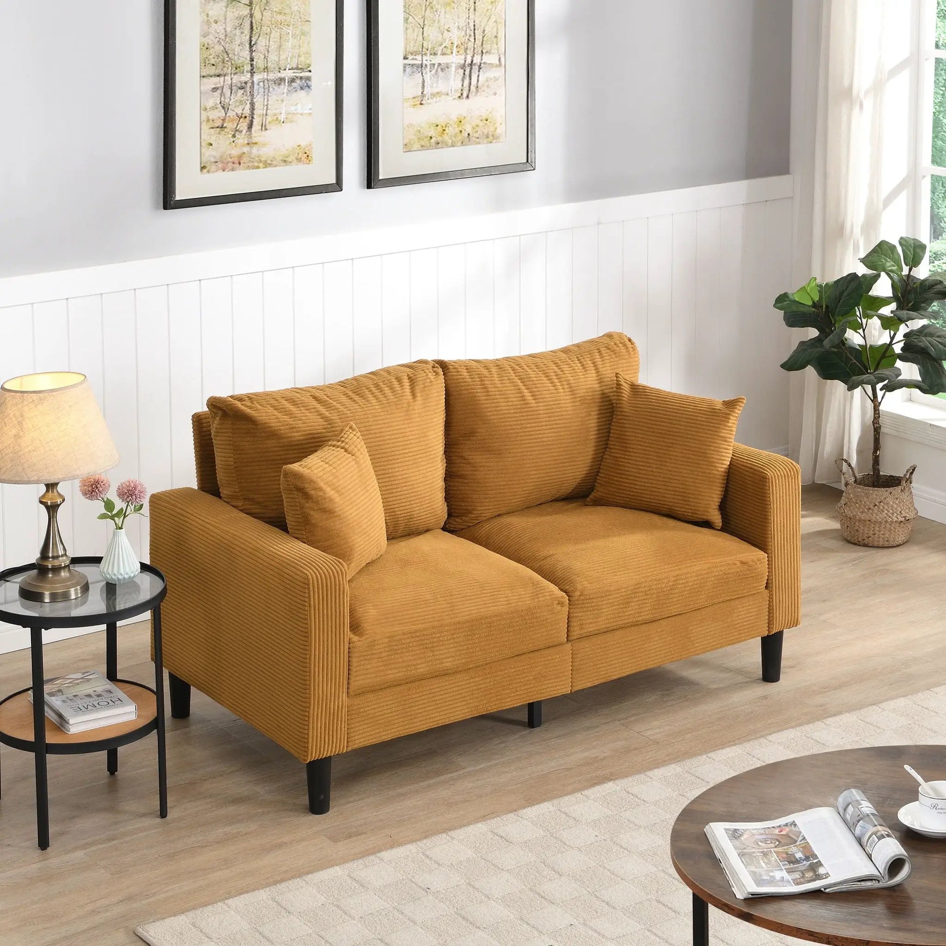 Modern upholstered stationary loveseat in warm caramel corduroy with two cushions and black legs on Tampa Home & Garden Store
