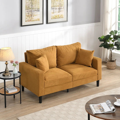 Modern upholstered stationary loveseat in warm caramel corduroy with two cushions and black legs on Tampa Home & Garden Store