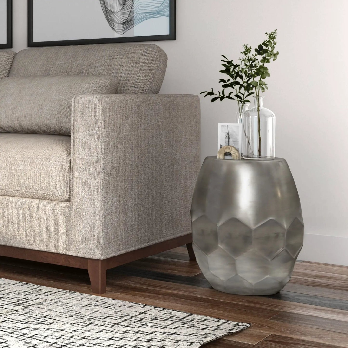 Flanigan hand crafted metal accent table with hammered geometric finish beside a beige sofa on Tampa Home & Garden Store