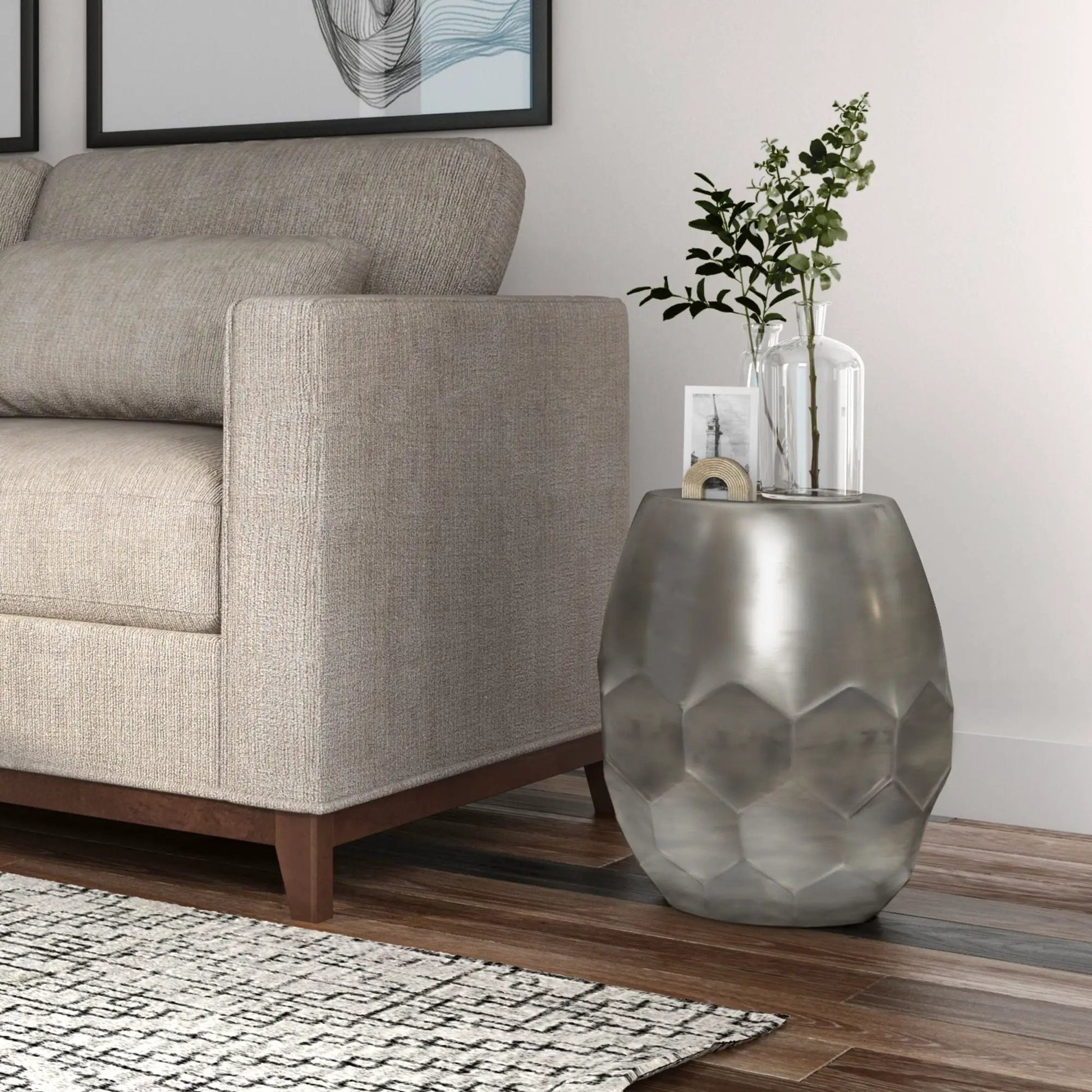 Flanigan hand crafted metal accent table with hammered geometric finish beside a beige sofa on Tampa Home & Garden Store